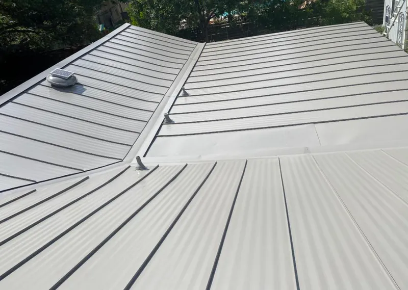 Solar attic fan installed on a metal roof for Roof Ventilation in Cheney